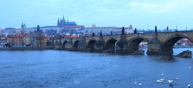 Charles Bridge with Prague Castle complex as a backdrop.